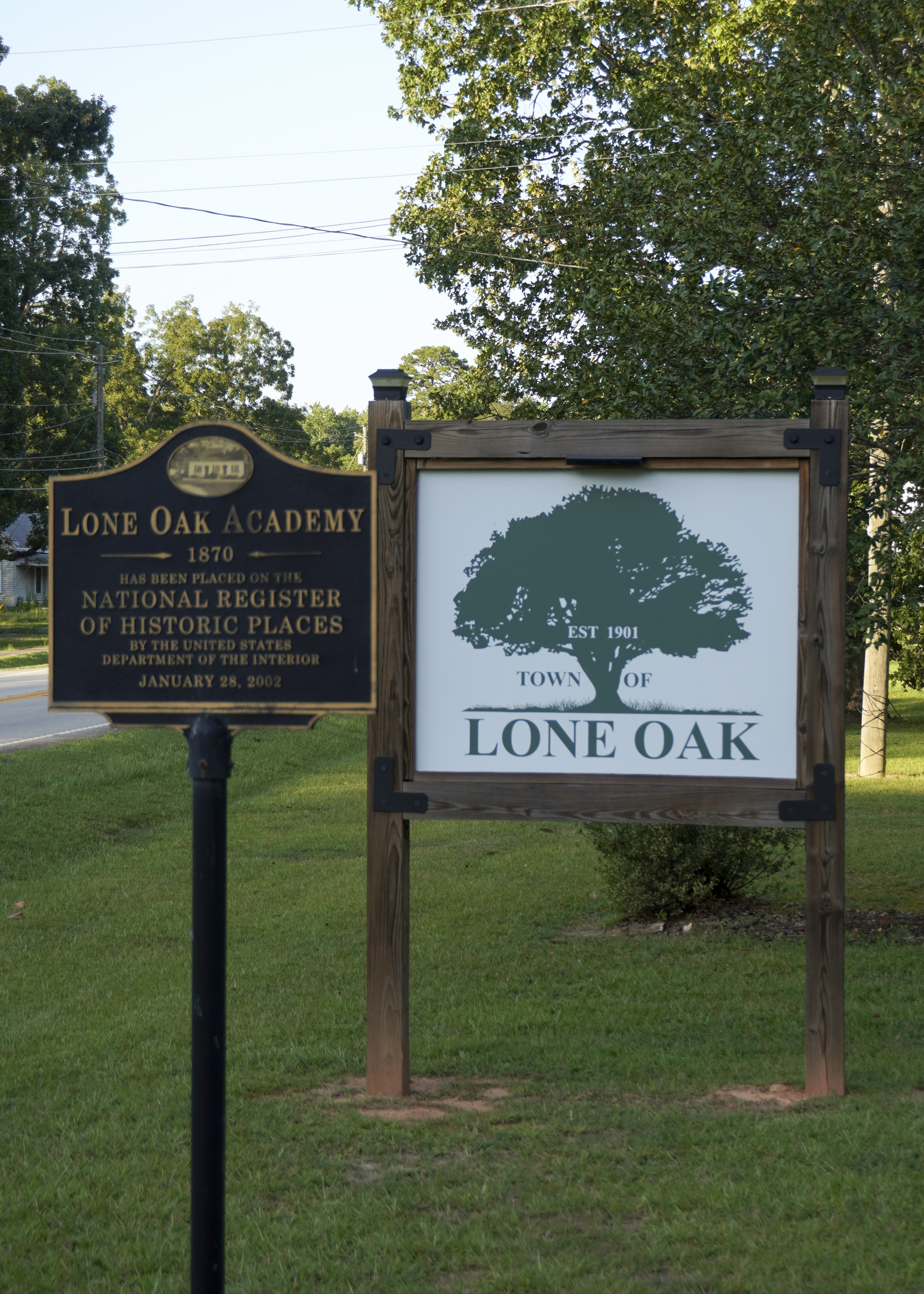 Lone Oak Academy Sign and Town of Lone Oak Est 1901 sign